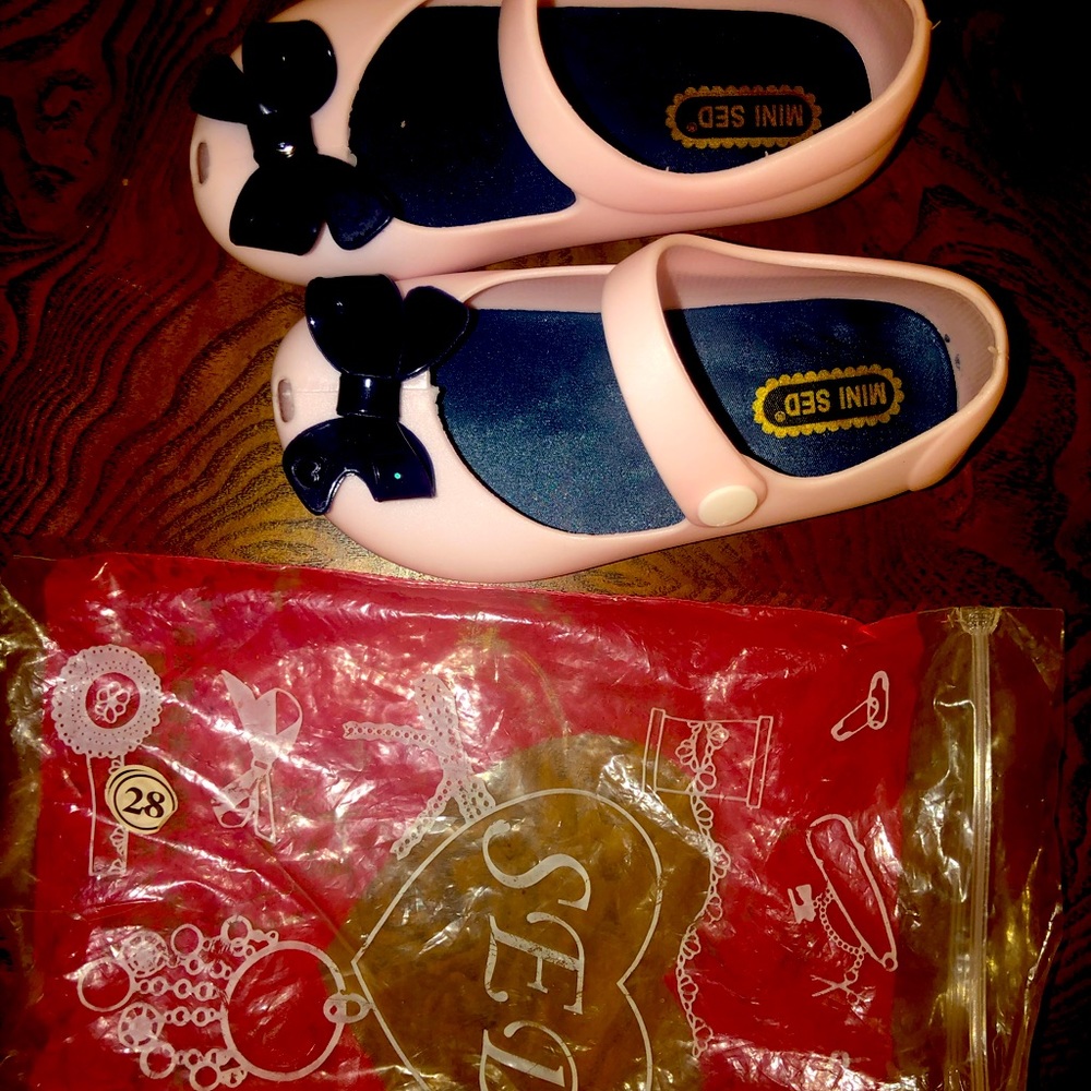 SED rubber baby girl bow shoes.  Never worn